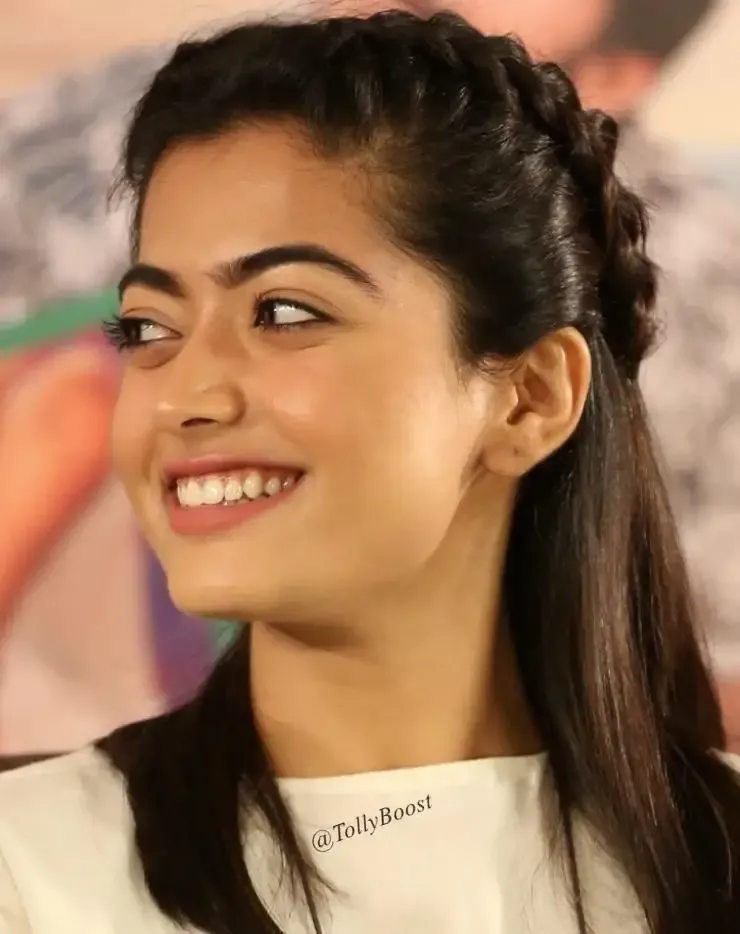 INDIAN ACTRESS RASHMIKA MANDANNA LONG HAIR SMILING FACE CLOSEUP 4